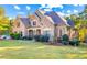 Large two-story house with brick and siding exterior at 145 Oak Forest Dr, Oxford, GA 30054