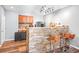 Basement bar with stone backsplash and seating at 145 Oak Forest Dr, Oxford, GA 30054