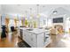 Spacious kitchen with island, stainless steel appliances, and white cabinetry at 145 Oak Forest Dr, Oxford, GA 30054