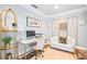Stylish home office with a white desk, comfortable seating, and modern decor at 145 Oak Forest Dr, Oxford, GA 30054
