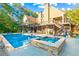 Large in-ground pool with attached spa and expansive patio at 145 Oak Forest Dr, Oxford, GA 30054