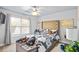 Bedroom with a gold upholstered bed and window at 145 Oak Forest Dr, Oxford, GA 30054