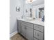 Bathroom with gray vanity and a vessel sink at 145 Oak Forest Dr, Oxford, GA 30054