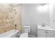 Clean bathroom with a bathtub, toilet and vanity with updated fixtures at 145 Oak Forest Dr, Oxford, GA 30054
