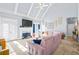 Two-story living room with vaulted ceilings, fireplace, and large windows at 145 Oak Forest Dr, Oxford, GA 30054