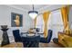 Modern dining room with a glass-top table and gold accents at 145 Oak Forest Dr, Oxford, GA 30054