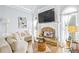 Cozy living room with fireplace and ample natural light at 145 Oak Forest Dr, Oxford, GA 30054