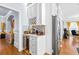 Built-in wine cooler and beverage center with white shaker cabinets at 145 Oak Forest Dr, Oxford, GA 30054