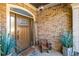 Elegant front entry with a wooden door and stone accents at 145 Oak Forest Dr, Oxford, GA 30054