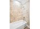 Updated bathroom with a new bathtub and shower, featuring modern fixtures at 145 Oak Forest Dr, Oxford, GA 30054