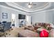 Bright Gathering room with sectional sofa, fireplace, and built-in shelving at 145 Oak Forest Dr, Oxford, GA 30054
