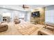 Spacious basement with a large TV and seating area at 145 Oak Forest Dr, Oxford, GA 30054