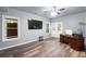Finished basement with vinyl flooring, large windows, and an office setup at 145 Oak Forest Dr, Oxford, GA 30054