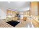 Bright kitchen featuring oak cabinets and granite countertops at 2639 Odum St, Snellville, GA 30078