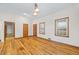 Spacious living area featuring hardwood floors and access to other rooms at 2639 Odum St, Snellville, GA 30078