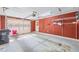 Attached garage with extra storage shelving at 2639 Odum St, Snellville, GA 30078