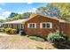 Brick ranch house showcasing its side profile with mature trees at 2639 Odum St, Snellville, GA 30078
