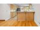 Kitchen with light wood cabinets, granite counters and tile floor at 2639 Odum St, Snellville, GA 30078