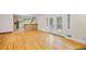 Living area with hardwood floors, kitchen view and French doors at 2639 Odum St, Snellville, GA 30078