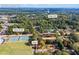 Aerial view showcasing home's location near tennis courts and school at 2639 Odum St, Snellville, GA 30078