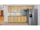 Kitchen boasts light wood cabinets, granite countertops and stainless steel appliances at 2639 Odum St, Snellville, GA 30078