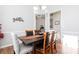 Bright dining room with hardwood floors and a charming wooden table at 131 Paddington Pl, Acworth, GA 30101