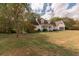 House with a large backyard and a detached garage at 15 Moores Spring Rd, Kingston, GA 30145