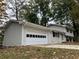 Newly painted house with attached garage and landscaping at 3666 Elkridge Dr, Decatur, GA 30032