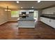 Modern kitchen with island, stainless steel appliances, and hardwood floors at 3666 Elkridge Dr, Decatur, GA 30032