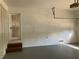 Interior of garage with white brick walls and epoxy floor at 3666 Elkridge Dr, Decatur, GA 30032