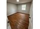 Spacious bedroom featuring hardwood floors and a window at 3666 Elkridge Dr, Decatur, GA 30032
