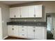Modern kitchen with white cabinets and granite countertops at 3666 Elkridge Dr, Decatur, GA 30032