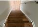 Oak wood stairs leading to the upper level at 3666 Elkridge Dr, Decatur, GA 30032