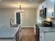 Modern kitchen with island, stainless steel appliances, and hardwood floors at 3666 Elkridge Dr, Decatur, GA 30032