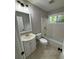 Updated bathroom with a white vanity, toilet, and bathtub at 3666 Elkridge Dr, Decatur, GA 30032