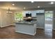 Modern kitchen with island, stainless steel appliances, and hardwood floors at 3666 Elkridge Dr, Decatur, GA 30032