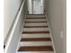 Interior stairs with wood steps and white risers at 3666 Elkridge Dr, Decatur, GA 30032