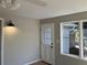 Entryway with white door and wall lights at 3666 Elkridge Dr, Decatur, GA 30032