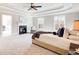 Main bedroom with fireplace, carpet, and plenty of natural light at 923 Oak Dr, Woodstock, GA 30189