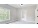 Bright bedroom with large windows and access to another room at 923 Oak Dr, Woodstock, GA 30189