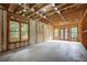 Unfinished basement with exposed framing, insulation, and large windows at 923 Oak Dr, Woodstock, GA 30189