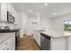 Modern kitchen with white cabinets and granite countertops at 1861 Holmsey Cir, Conyers, GA 30094