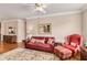 Living room with red leather sofa and chair, offering a cozy atmosphere at 2300 Peachford Rd # 1209, Atlanta, GA 30338