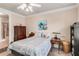 Bright bedroom with double bed, dresser, and access to the bathroom at 2300 Peachford Rd # 1209, Atlanta, GA 30338