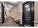 Building hallway with dark wood door and seating at 2300 Peachford Rd # 1209, Atlanta, GA 30338