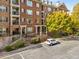 Brick building exterior with landscaping and parking at 2300 Peachford Rd # 1209, Atlanta, GA 30338