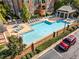 Community pool with plenty of lounge chairs at 2300 Peachford Rd # 1209, Atlanta, GA 30338