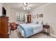 Bedroom with a queen bed, dresser, and ceiling fan at 2300 Peachford Rd # 1209, Atlanta, GA 30338