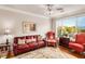 Relaxing living room with leather sofa, armchairs, and a large window at 2300 Peachford Rd # 1209, Atlanta, GA 30338