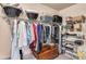 Large walk-in closet with shelving and hanging rods at 2300 Peachford Rd # 1209, Atlanta, GA 30338